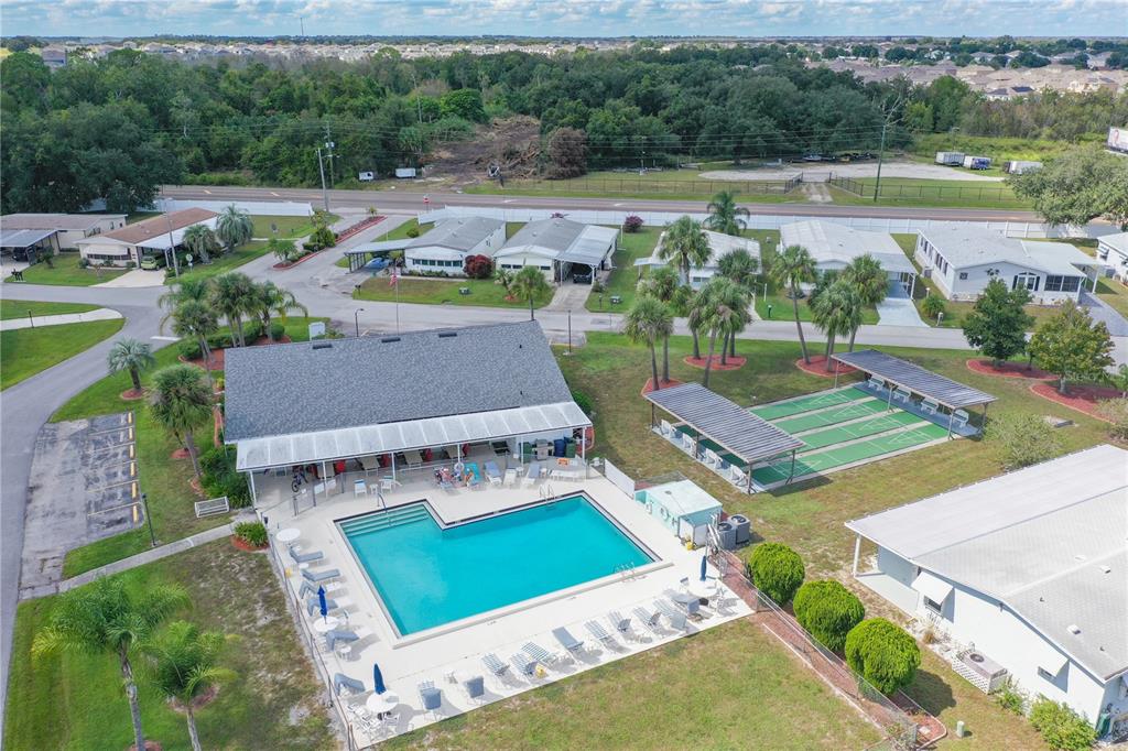 6518 Raintree Lane Winter Haven, FL 33881 - Photo 3 of 42 an aerial view of a house with a garden and lake view