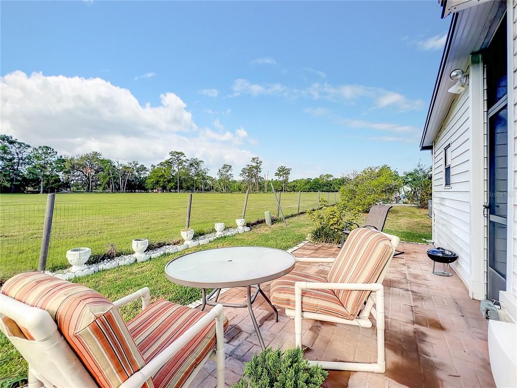 6518 Raintree Lane Winter Haven, FL 33881 - Photo 35 of 42 a view of swimming pool with outdoor seating and city view
