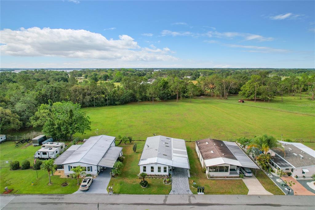 6518 Raintree Lane Winter Haven, FL 33881 - Photo 36 of 42 a view of a lake with couches and city view