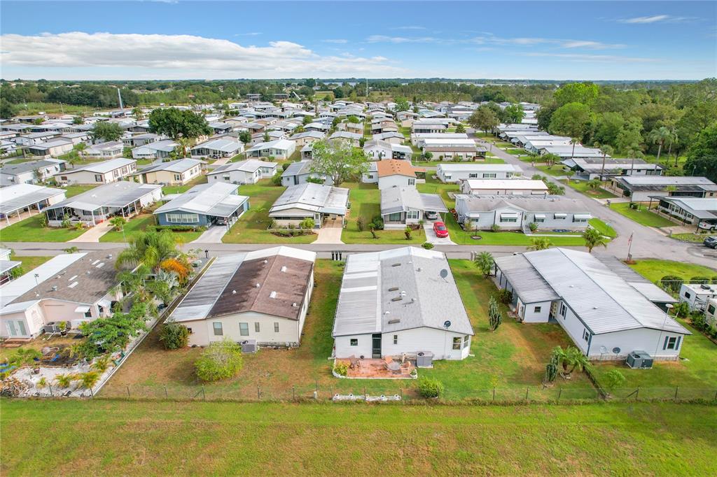 6518 Raintree Lane Winter Haven, FL 33881 - Photo 38 of 42 an aerial view of residential houses with outdoor space