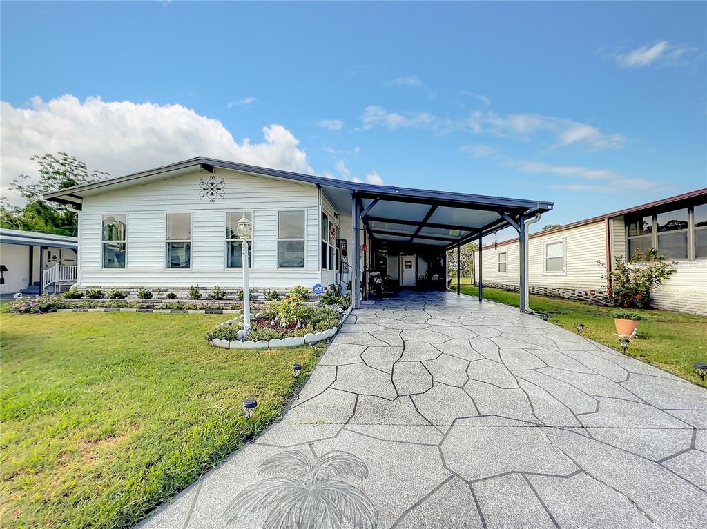 6518 Raintree Lane Winter Haven, FL 33881 - Photo 42 of 42 a front view of a house with garden