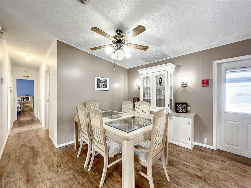 6518 Raintree Lane Winter Haven, FL 33881 - Photo 6 of 42 a dining room with furniture and window