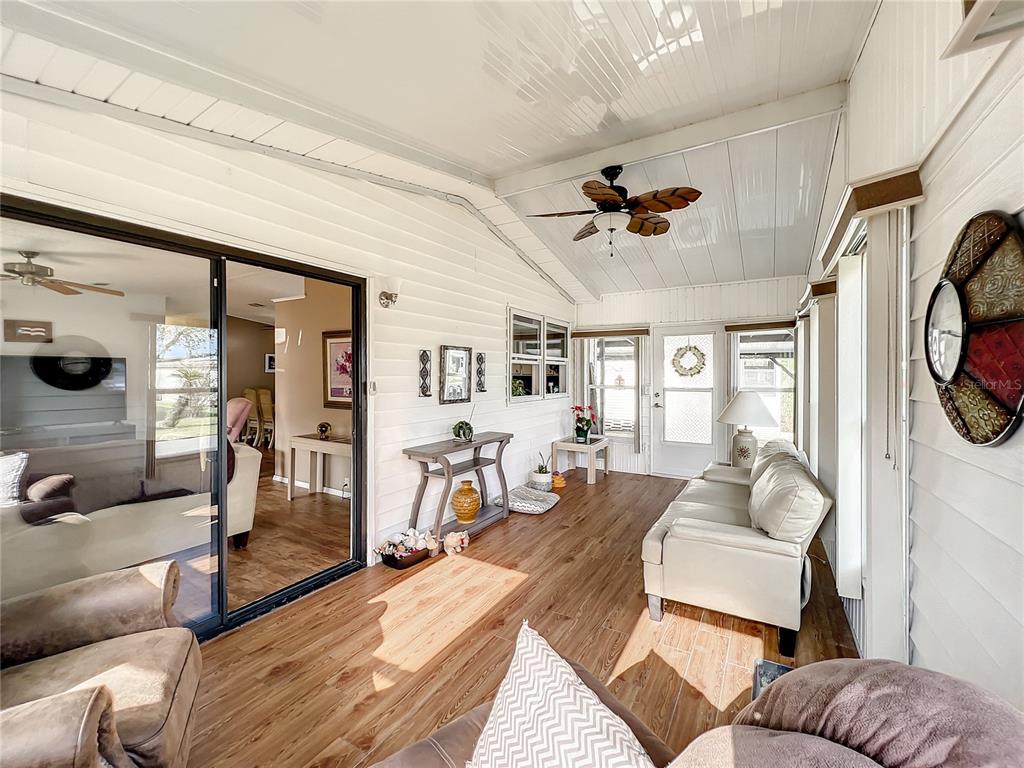 6518 Raintree Lane Winter Haven, FL 33881 - Photo 7 of 42 a living room with furniture and a window