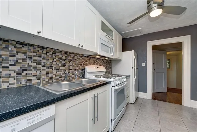 a kitchen with a sink and cabinets