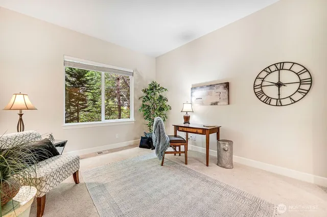 a bed room with a bed and a chair