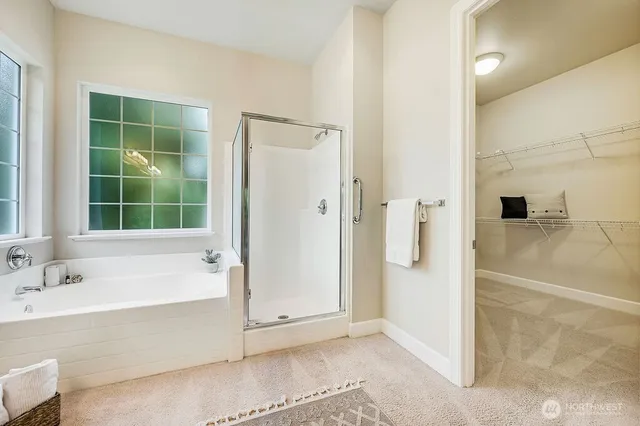 a bathroom with a bathtub and a shower