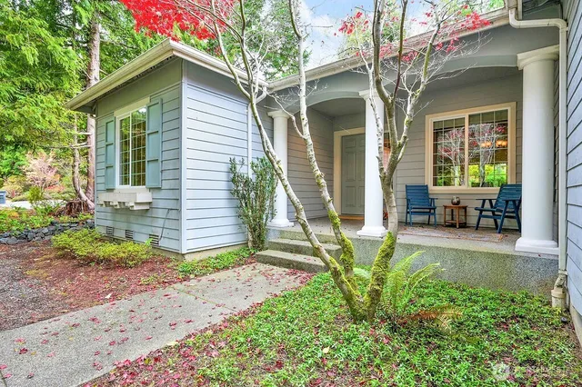 a front view of a house with garden