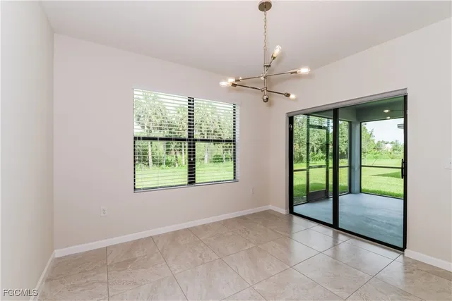 a view of an empty room with glass door