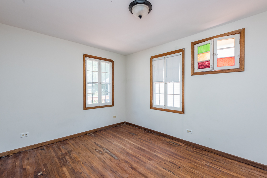 46 Tremont Road Fox Lake, IL 60020 - Photo 11 of 19 a view of an empty room with wooden floor and a window