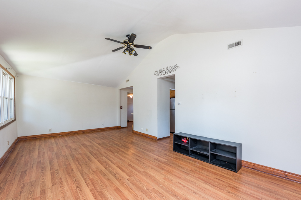 46 Tremont Road Fox Lake, IL 60020 - Photo 3 of 19 a view of a room with wooden floor and a ceiling fan
