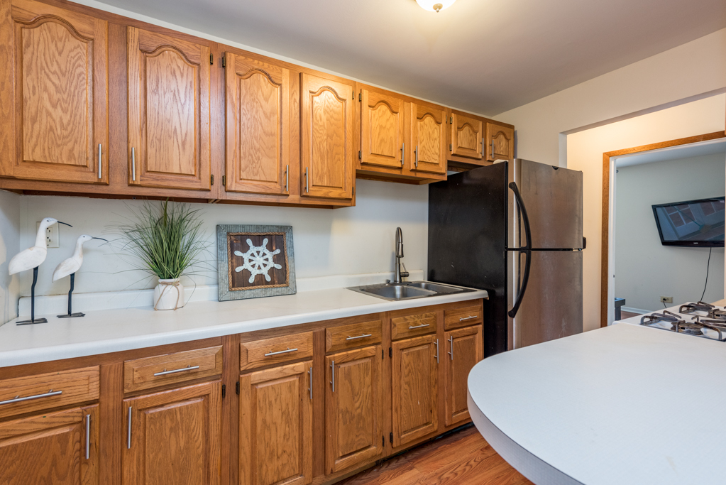 46 Tremont Road Fox Lake, IL 60020 - Photo 5 of 19 a kitchen with stainless steel appliances granite countertop a refrigerator sink and cabinets