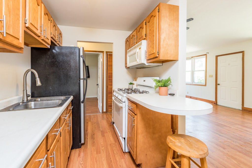 46 Tremont Road Fox Lake, IL 60020 - Photo 6 of 19 a kitchen with sink and refrigerator