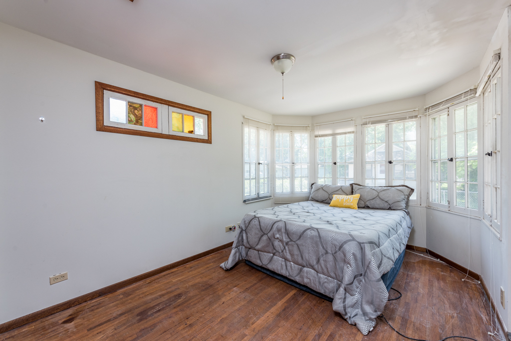 46 Tremont Road Fox Lake, IL 60020 - Photo 9 of 19 a bedroom with a bed and wooden floor
