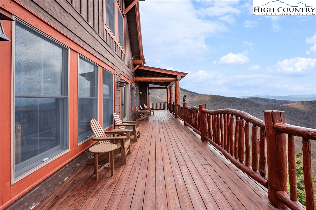 635 Acorn Road Zionville, NC 28698 - Photo 22 of 50 a balcony with wooden floor table and chairs