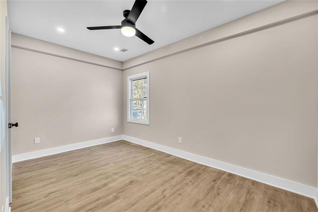 1874 Phillips Avenue East Point, GA 30344 - Photo 18 of 19 wooden floor in an empty room