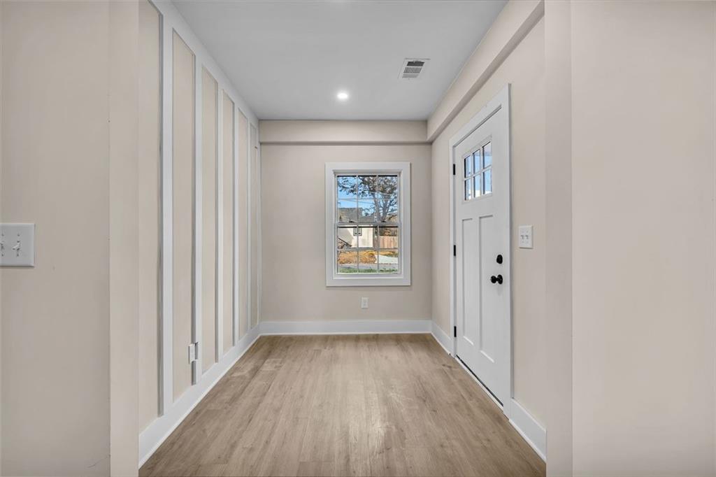 1874 Phillips Avenue East Point, GA 30344 - Photo 4 of 19 a view of a hallway with wooden floor and closet