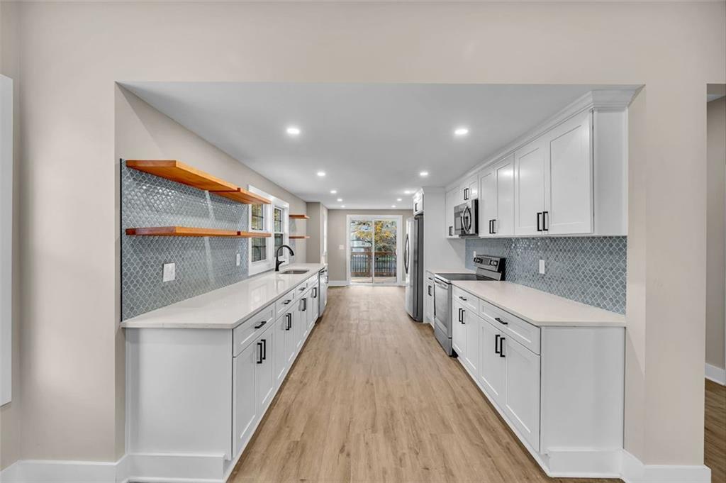 1874 Phillips Avenue East Point, GA 30344 - Photo 7 of 19 a large kitchen with a lot of counter space