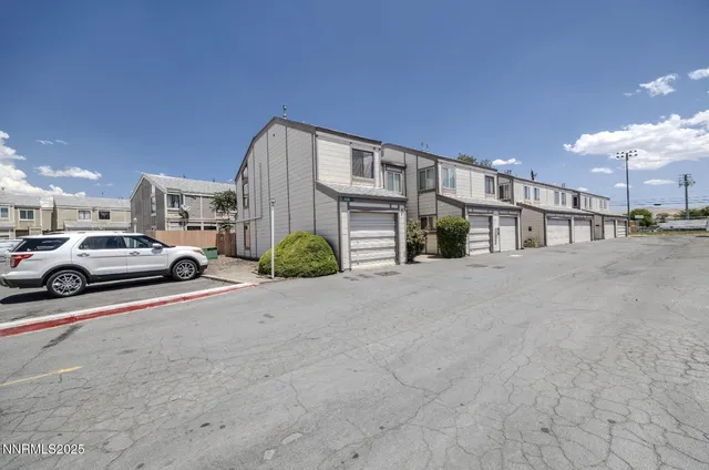 a view of car parked in front of house