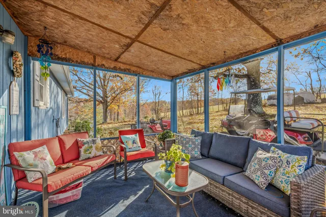 a view of a yard with wooden fence