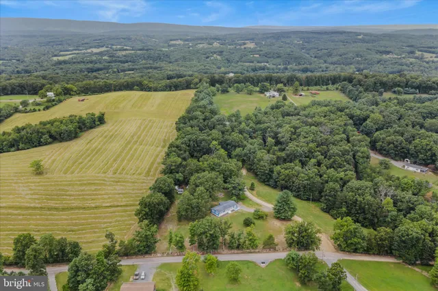 a view of a lake top with green space