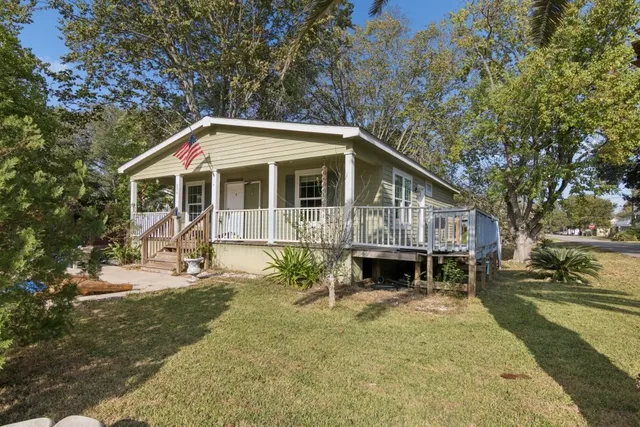 a front view of a house with a yard outdoor seating and yard