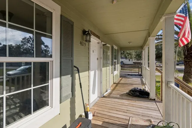 a view of a balcony with wooden floor