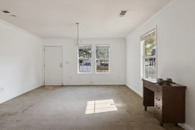 a view of an empty room with a window