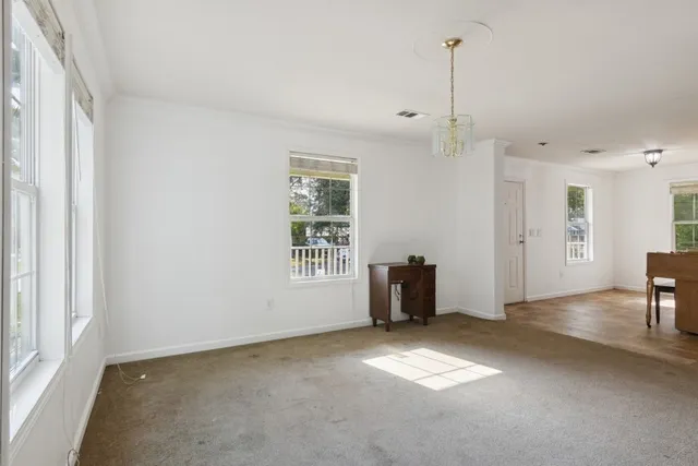 a dining room with a window and furniture