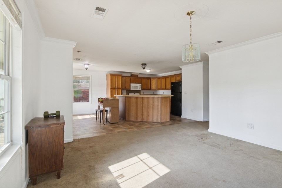 4619 2nd Street Bacliff, TX 77518 - Photo 9 of 24 a view of kitchen with furniture and refrigerator