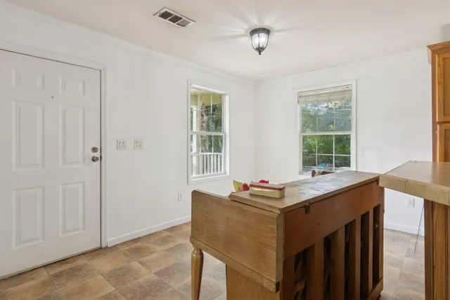 a kitchen with a refrigerator a stove top oven and a refrigerator