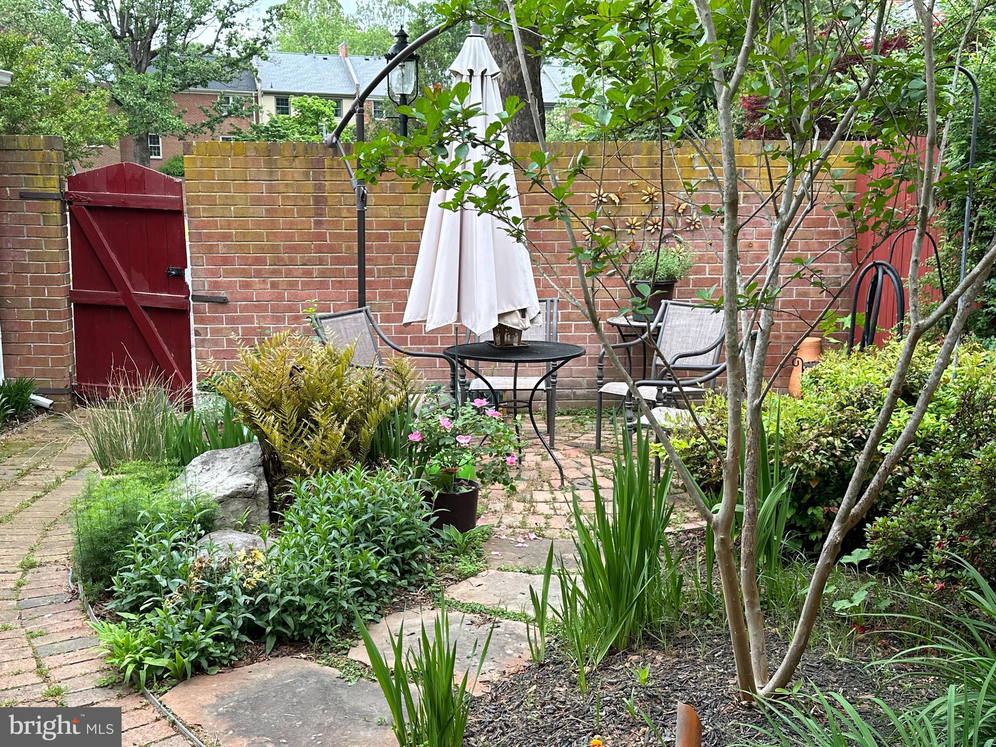 8244 Carrleigh Parkway Springfield, VA 22152 - Photo 5 of 25 a front view of a house with a garden
