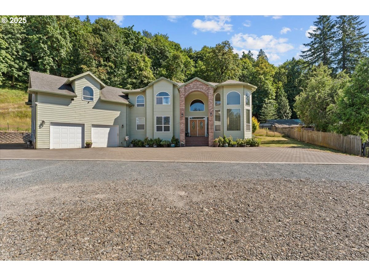 5122 Southeast Jenne Road Portland, OR 97236 - Photo 4 of 36 a front view of a house with a yard