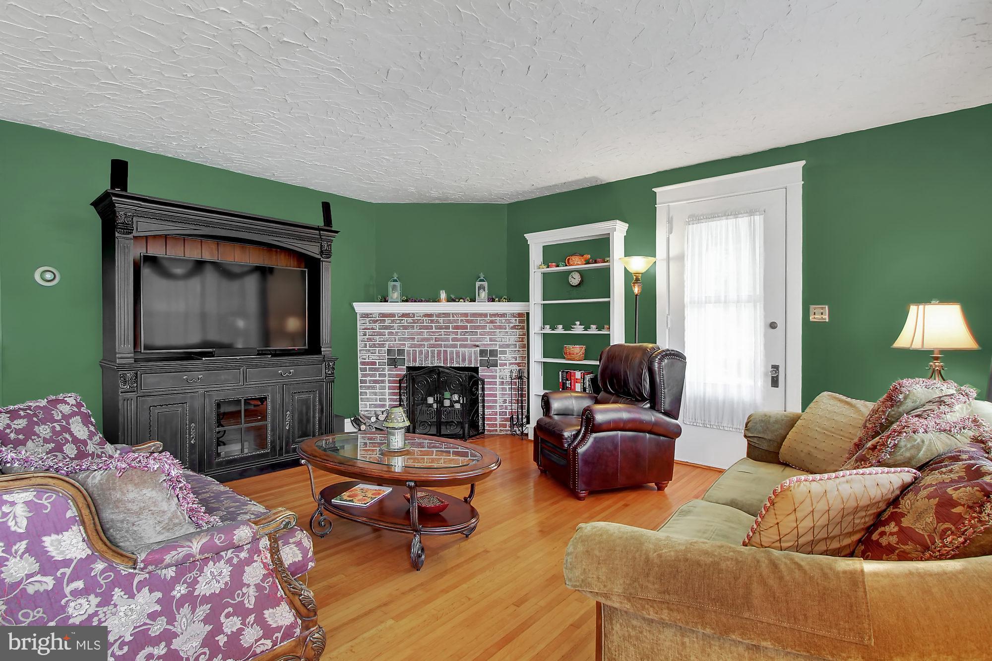 1704 Friedensburg Road Reading, PA 19606 - Photo 2 of 25 a living room with furniture and a fireplace