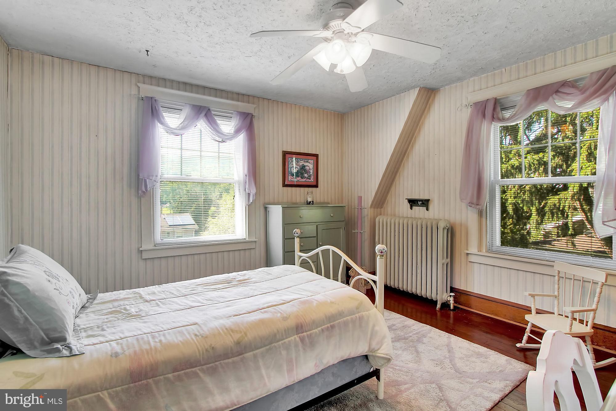1704 Friedensburg Road Reading, PA 19606 - Photo 13 of 25 a bed sitting in a bedroom next to a window