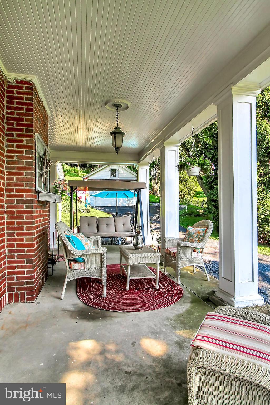1704 Friedensburg Road Reading, PA 19606 - Photo 25 of 25 a view of a patio with table and chairs potted plants with floor to ceiling window