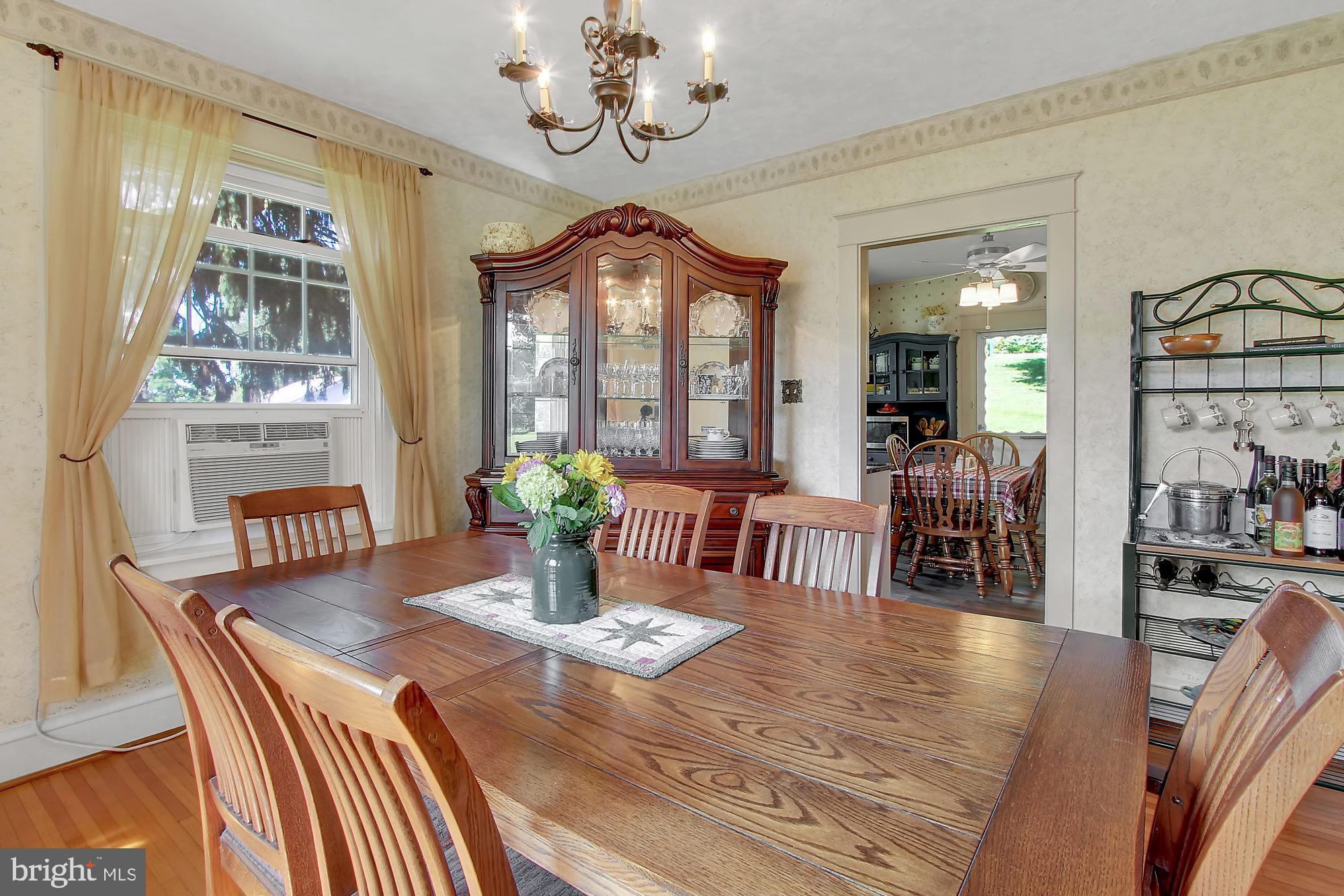 1704 Friedensburg Road Reading, PA 19606 - Photo 5 of 25 a view of a dining room with furniture a chandelier and wooden floor