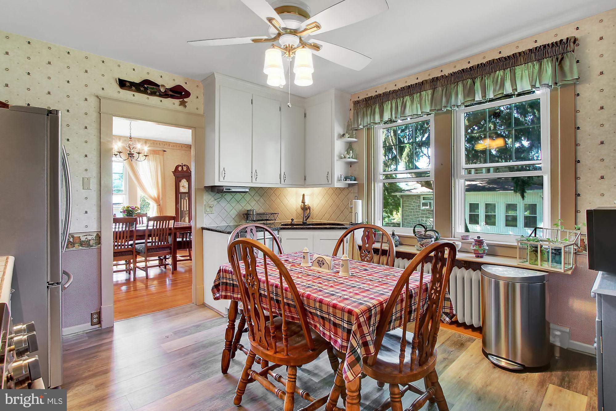 1704 Friedensburg Road Reading, PA 19606 - Photo 6 of 25 a view of a dining room with furniture window and wooden floor