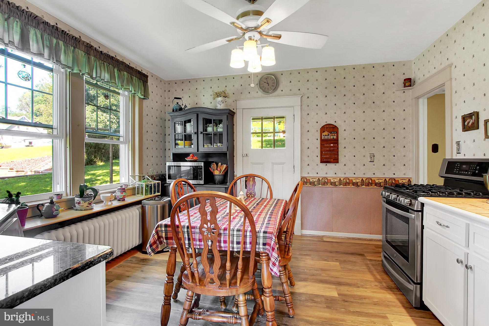 1704 Friedensburg Road Reading, PA 19606 - Photo 7 of 25 a view of a dining room with furniture a chandelier and large window