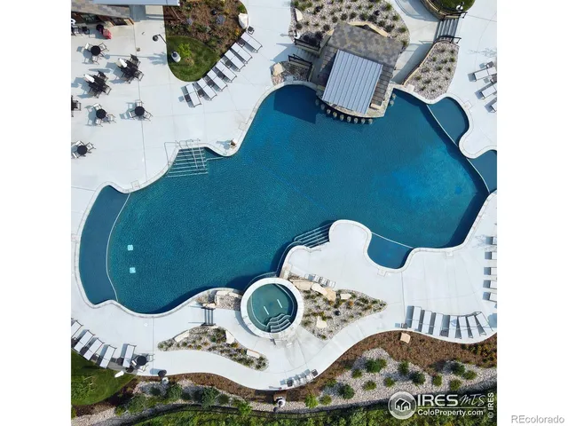 an aerial view of a house sitting space and a kitchen view