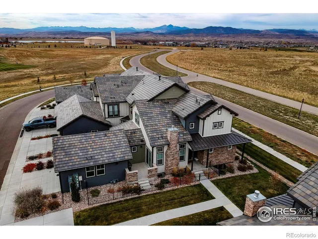 a aerial view of a house with a ocean view