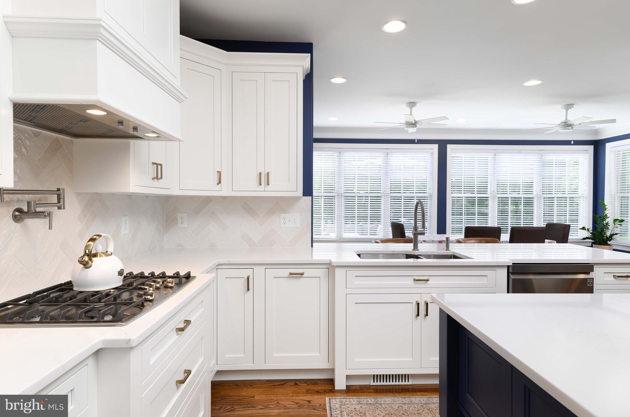 128 Harrogate Drive Landenberg, PA 19350 - Photo 20 of 52 a kitchen with a sink window and cabinets