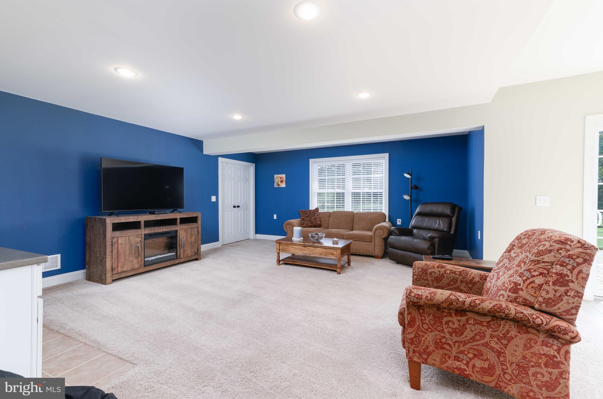 128 Harrogate Drive Landenberg, PA 19350 - Photo 40 of 52 a living room with furniture and a flat screen tv