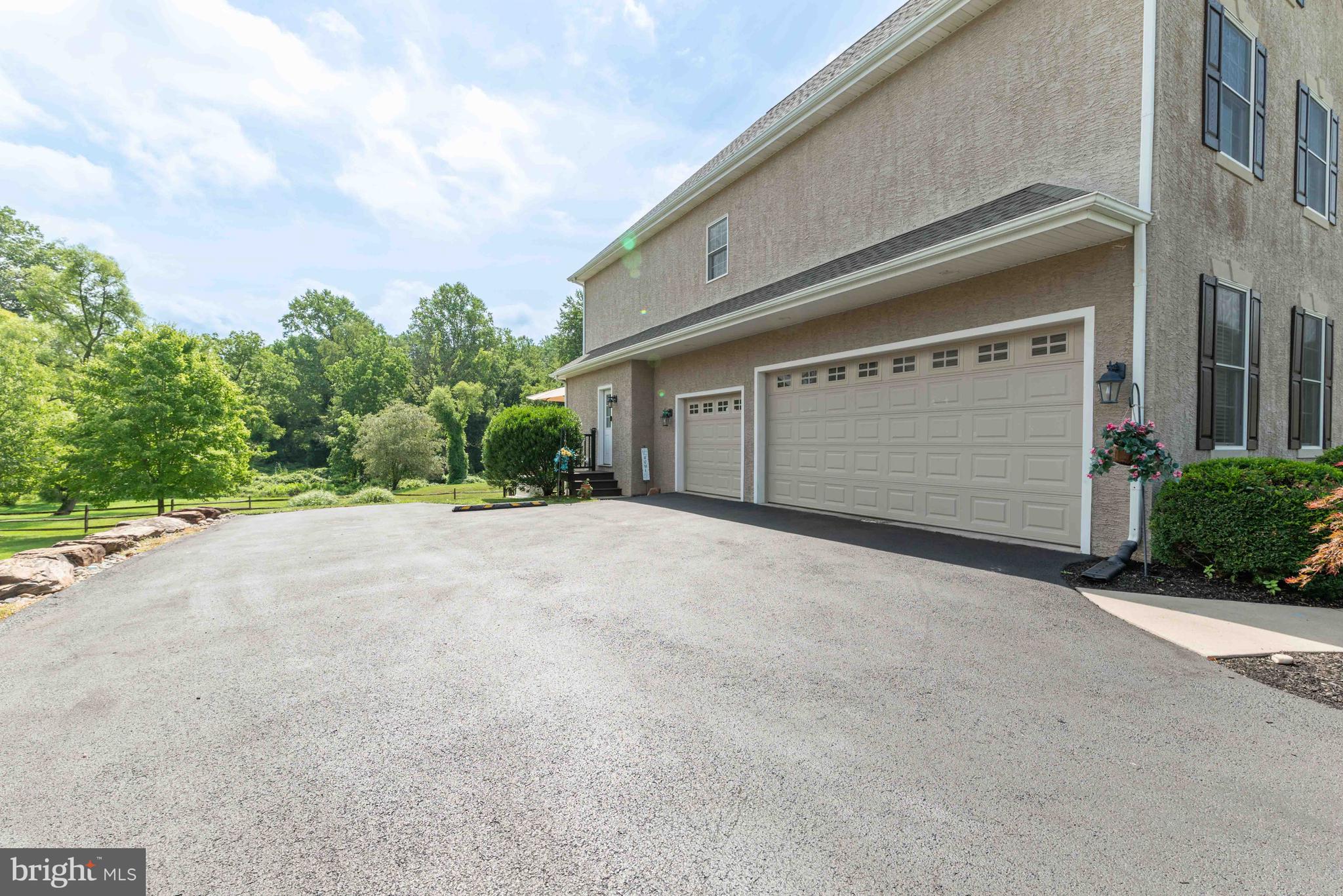 128 Harrogate Drive Landenberg, PA 19350 - Photo 44 of 52 a front view of a house with a yard and garage