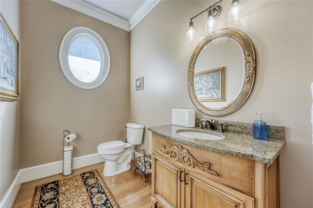 2380 Muskogee Lane Braselton, GA 30517 - Photo 18 of 30 a bathroom with a granite countertop double vanity and a mirror