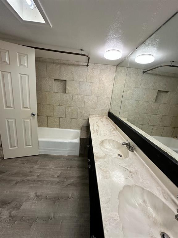 600 Liddon Avenue, Unit 80 Midland, TX 79705 - Photo 11 of 11 a bathroom with a bathtub and a shower