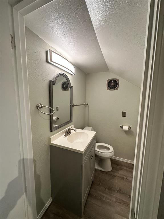 600 Liddon Avenue, Unit 80 Midland, TX 79705 - Photo 10 of 11 a bathroom with a toilet sink and mirror