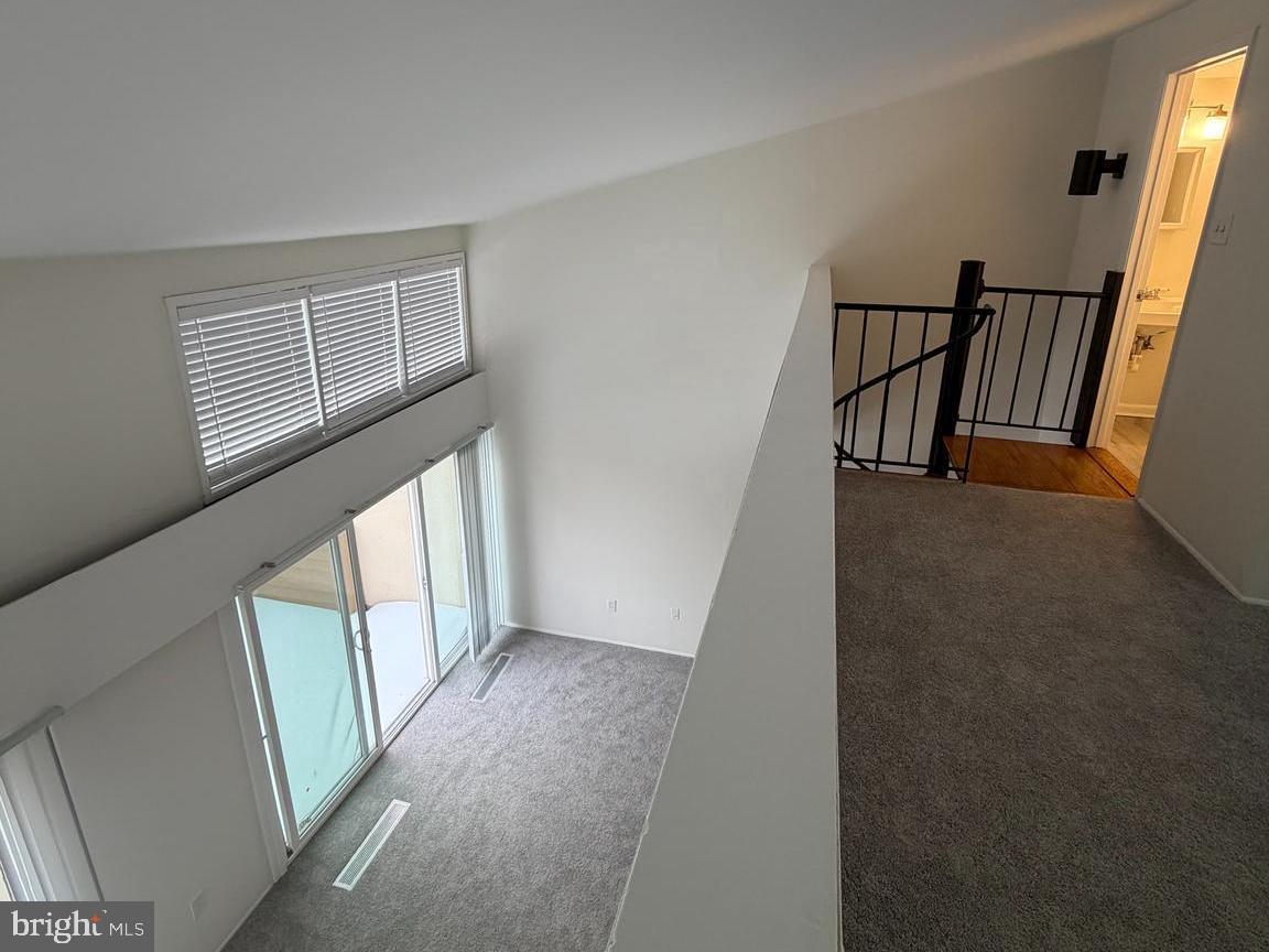 5485 Harpers Farm Road, Unit L3 Columbia, MD 21044 - Photo 14 of 24 a view of an entryway with wooden floor