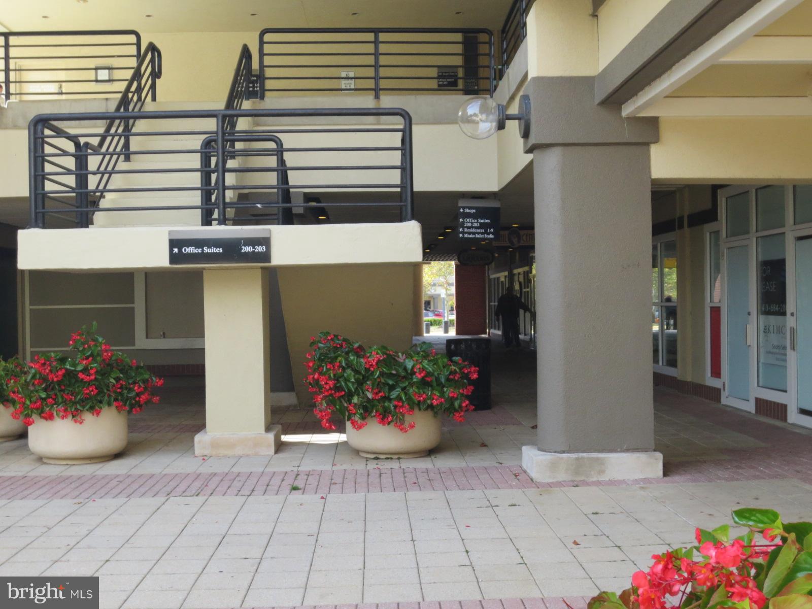 5485 Harpers Farm Road, Unit L3 Columbia, MD 21044 - Photo 21 of 24 a front view of a house with flowers