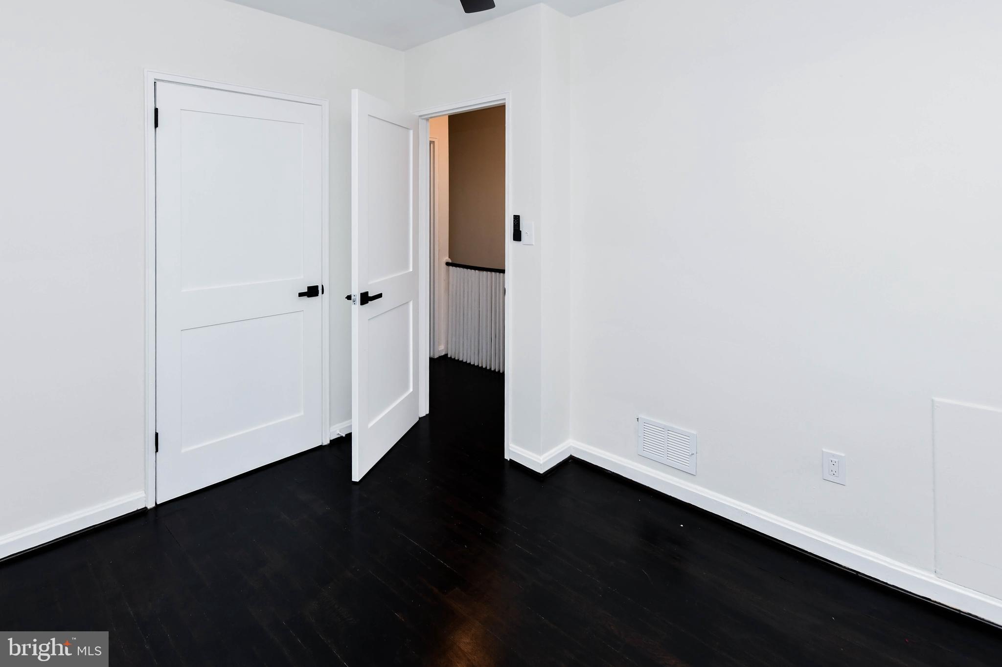 4227 Nash Street Southeast Washington, DC 20020 - Photo 11 of 50 an empty room with wooden floor