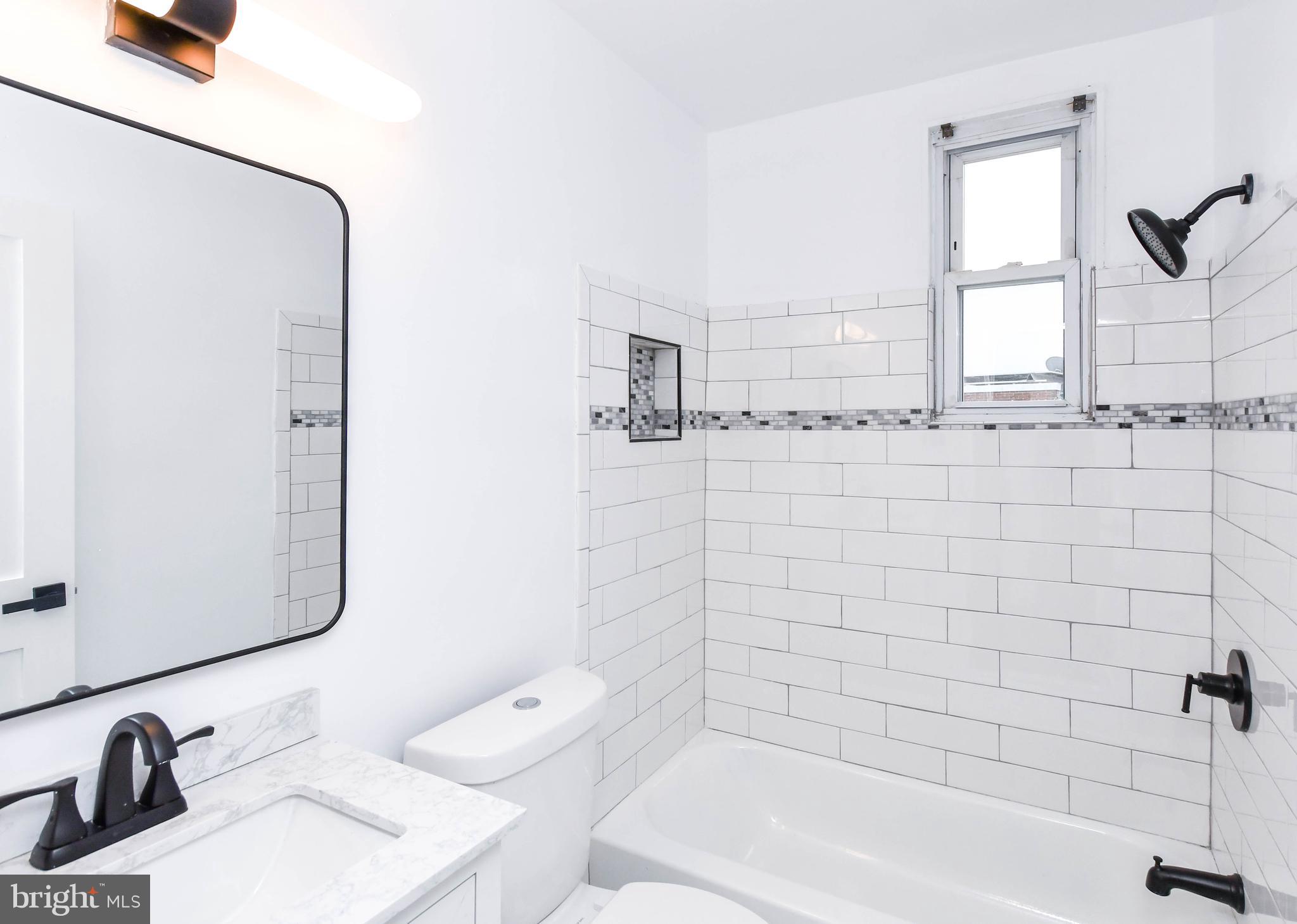 4227 Nash Street Southeast Washington, DC 20020 - Photo 13 of 50 a bathroom with a bathtub sink vanity and toilet